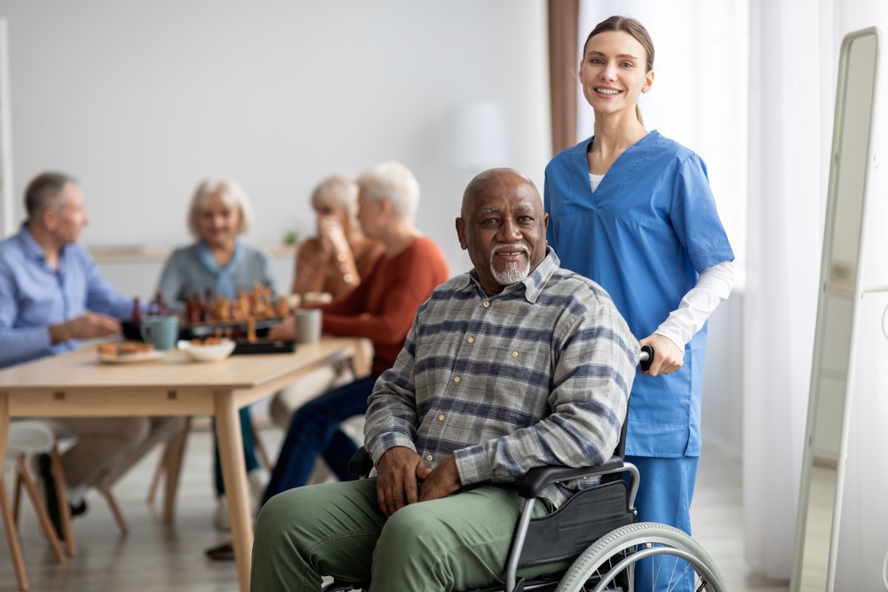 happy,black,man,older,patient,on,wheelchair,with,female,nurse happy,black,man,older,patient,on,wheelchair,with,female,nurse
