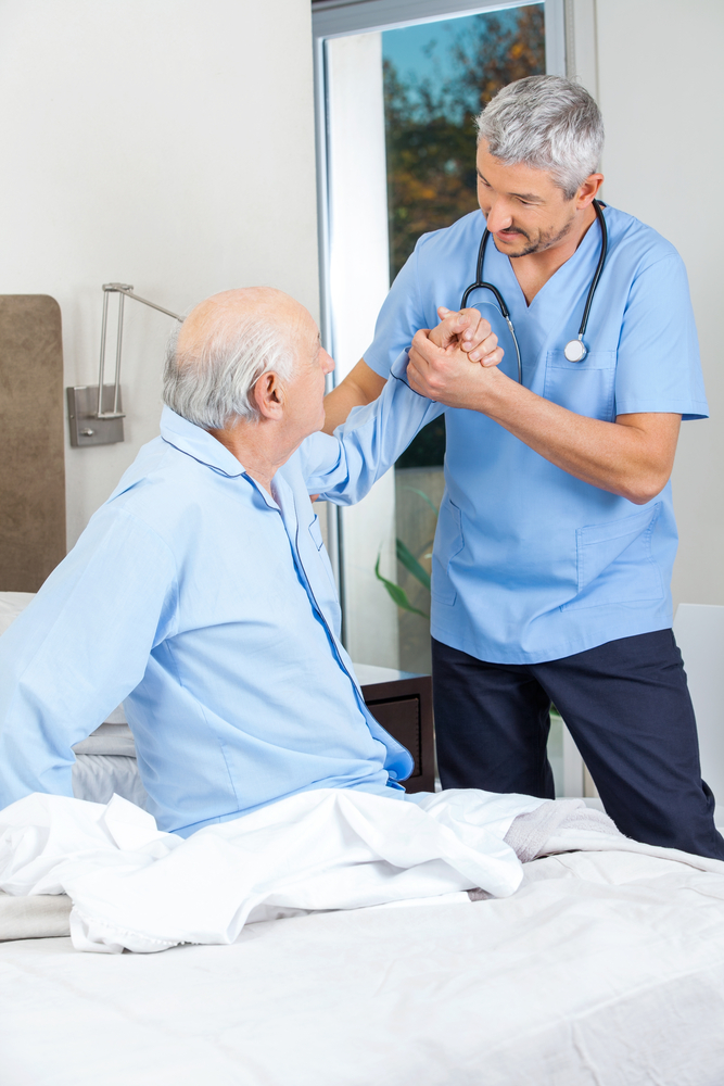 male,caretaker,supporting,senior,man,to,get,up,from,bed male,caretaker,supporting,senior,man,to,get,up,from,bed